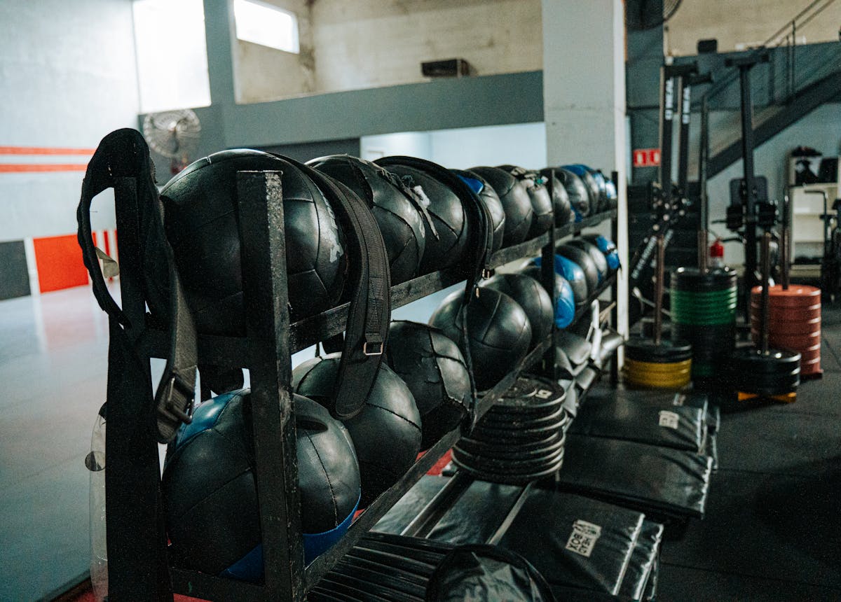 The training floor at Forge — racks, plates, and conditioning gear